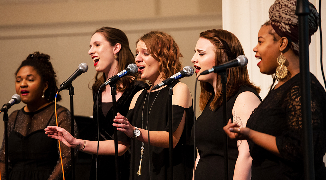 Five student jazz singers performing together