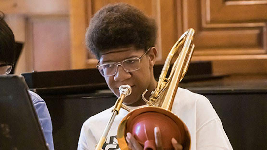 Jazz camp student playing instrument