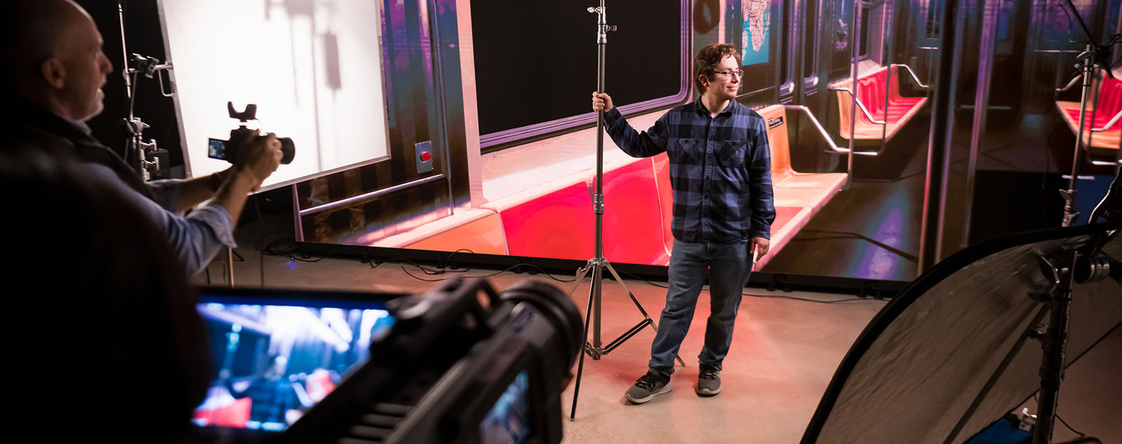 Students and faculty work with lighting and cameras in the new sound stage.