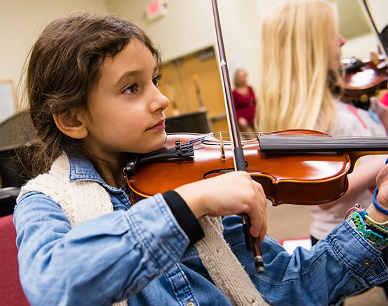 brown-haired girl playing violin
