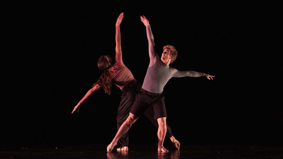 Two dancers performing on stage.