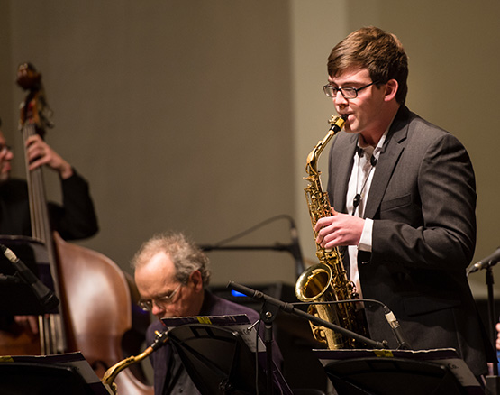 Student playing saxophone in jazz collective
