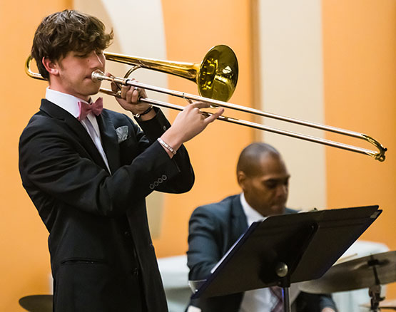 Music student playing trombone