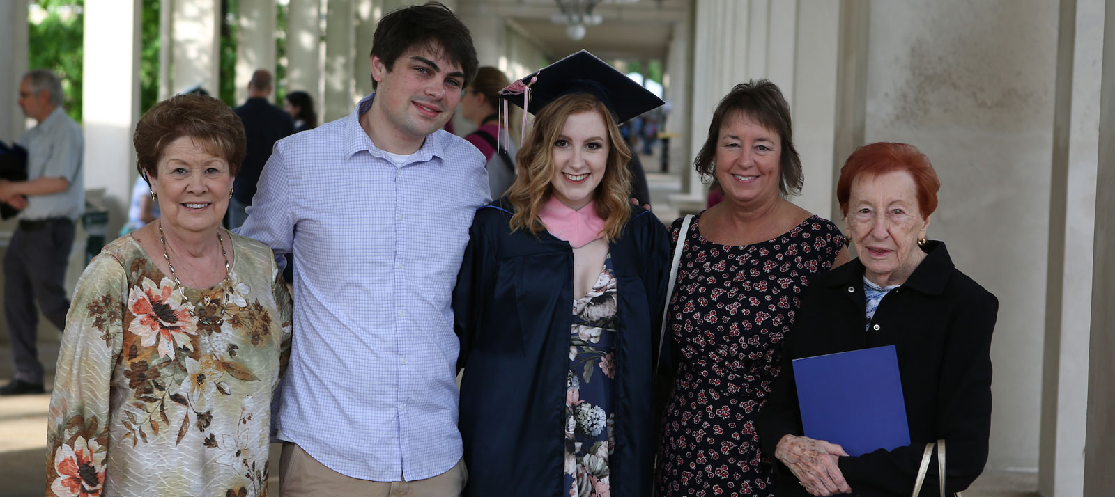 Graduate poses with her family.