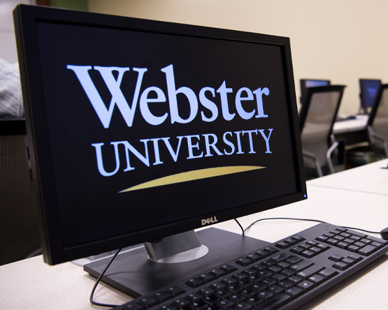 A computer with the Webster logo as its screensaver.